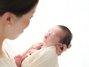 Woman holding a baby